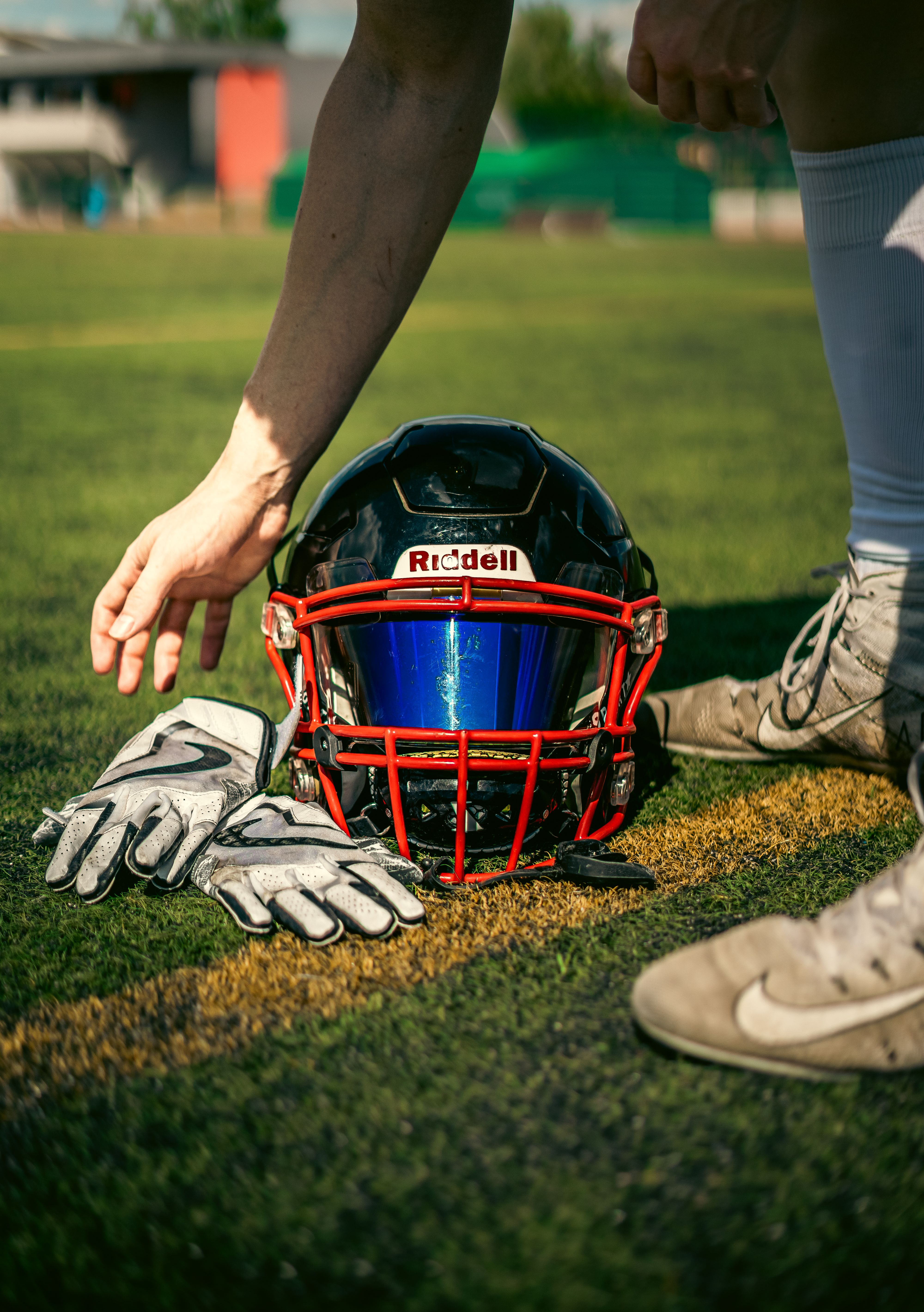 Football gear resting on the field