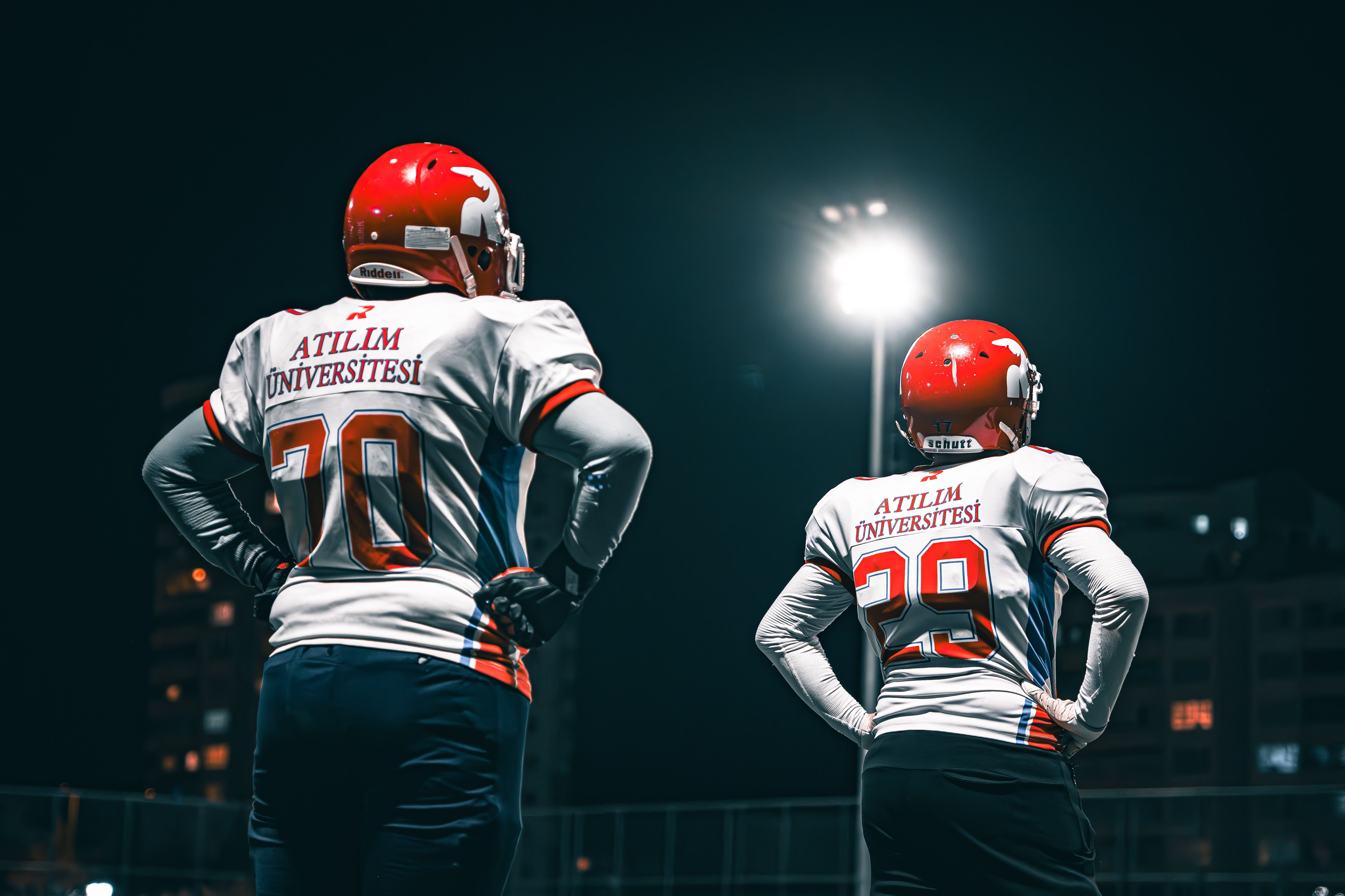 Players under stadium lights at night
